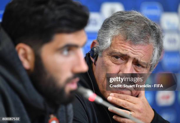 Fernando Santos, head coach of Portugal looks on as Luis Neto talks to the media during a press conference of the Portugal national football team on...