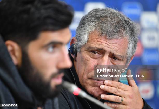 Fernando Santos, head coach of Portugal looks on as Luis Neto talks to the media during a press conference of the Portugal national football team on...