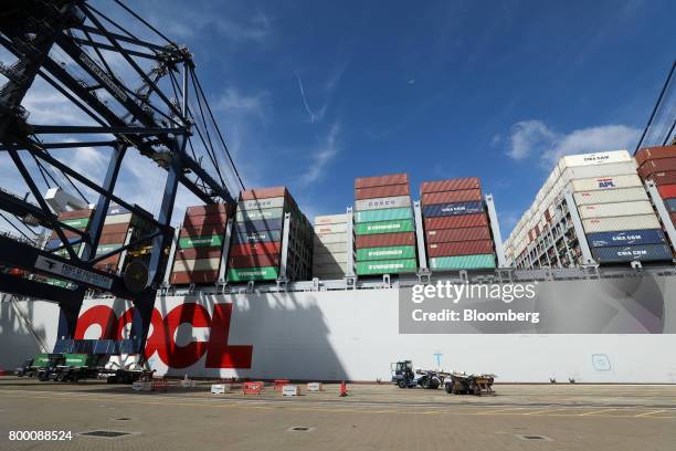 The Orient Overseas Container Line's Hong Kong container ship sits anchored dockside at the Port of Felixstowe Ltd., a subsidiary of CK Hutchison...