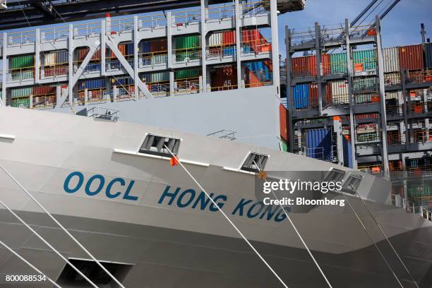 The Orient Overseas Container Line's Hong Kong container ship sits anchored dockside at the Port of Felixstowe Ltd., a subsidiary of CK Hutchison...