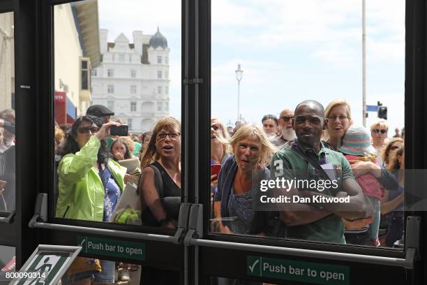 Activists wait outside the conference centre for Labour Leader Jeremy Corbyn after he addressed delegates at the Unison Conference on June 23, 2017...