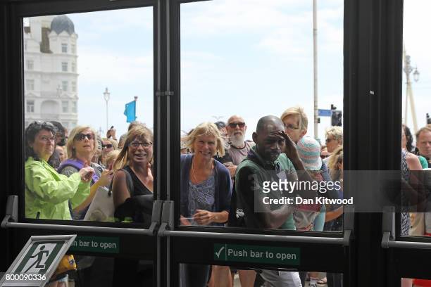 Activists wait outside the conference centre for Labour Leader Jeremy Corbyn after he addressed delegates at the Unison Conference on June 23, 2017...