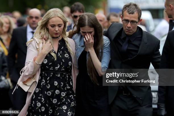 Family members and friends follow the funeral cortege of Manchester attack victim Lisa Lees as her coffin arrives at St Anne's Church on June 23,...
