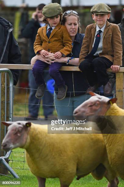 Zara, Ailsa and Alfie Teasdale,look on as farmers show their sheep at the Royal Highland show on June 23, 2017 in Edinburgh, Scotland.The Royal...