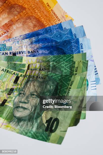 Collection of mixed denomination South African rand banknotes sit in an arranged photo in Johannesburg, South Africa, on Thursday, June 22, 2017....