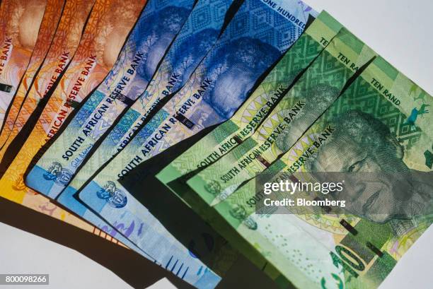 Collection of mixed denomination South African rand banknotes sit in an arranged photo in Johannesburg, South Africa, on Thursday, June 22, 2017....