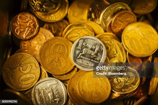 Collection of mixed denomination South African rand coins sit in an arranged photo in Johannesburg, South Africa, on Thursday, June 22, 2017. South...