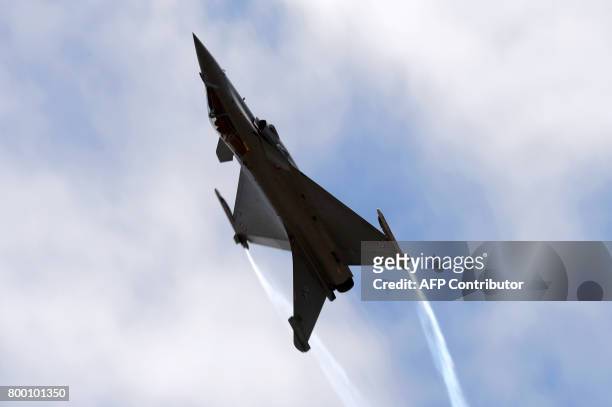 Dassault Aviation Rafale jet fighter performs during the International Paris Air Show in Le Bourget near Paris on June 23, 2017. / AFP PHOTO / ERIC...