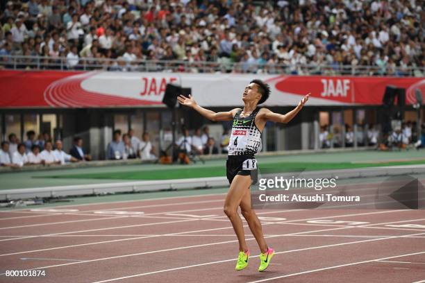 Suguru Osako of Japan celebrates after winning in the Men 10000m final during the 101st Japan National Championships at Yanmar Stadium Nagai on June...