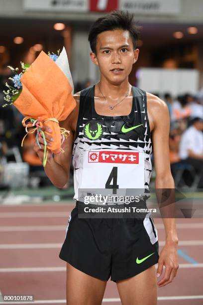 Suguru Osako of Japan poses after winning in the Men 10000m final during the 101st Japan National Championships at Yanmar Stadium Nagai on June 23,...