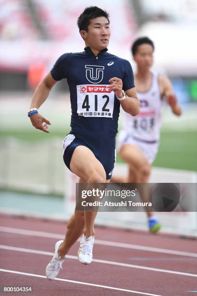 Yoshihide Kiryu of Japan competes in the Men 100m heat 5 during the 101st Japan National Championships at Yanmar Stadium Nagai on June 23, 2017 in...