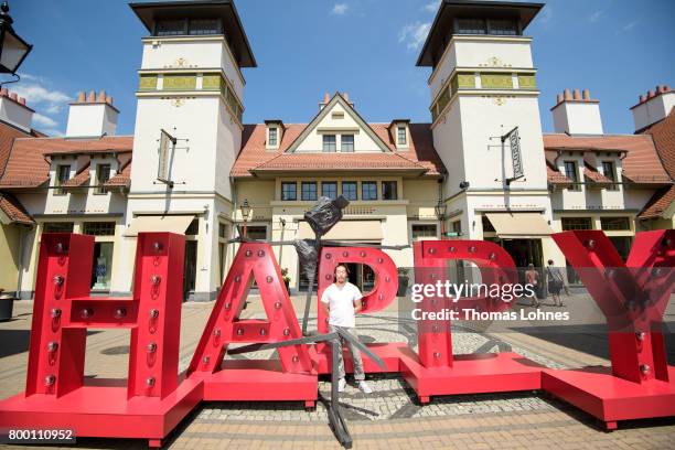 The artist Il-Jin Atem Chio pictured next to on of his skulptures at Wertheim Village on June 20, 2017 in Wertheim, Germany. Il-Jin Atem Chio has...