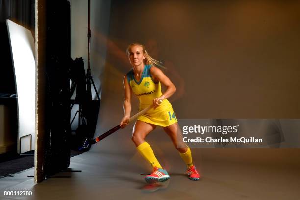 Stephanie Kershaw of Australia runs across a studio floor during a player portrait photo session for FINTRO Hockey World League on June 23, 2017 in...