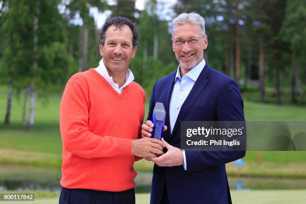 Santiago Luna of Spain poses with the trophy and Petri Keskitalo, Managing Director Linna Golf after the final round of the European Tour Properties...