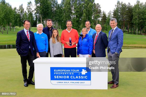 Santiago Luna of Spain poses with the trophy and the European Senior tour staff after the final round of the European Tour Properties Senior Classic...