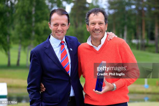 Santiago Luna of Spain poses with the trophy and David MacLaren, Head of European Senior Tour after the final round of the European Tour Properties...