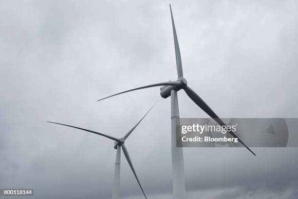 The blades and nascelles of offshore floating wind turbines sit during assembly in the Hywind pilot park, operated by Statoil ASA, in Stord, Norway,...