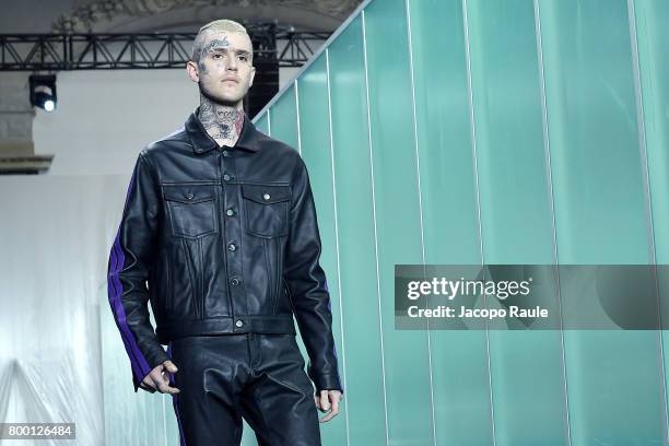 Lil Peep walks the runway during the Vlone Menswear Spring/Summer 2018 show as part of Paris Fashion Week on June 23, 2017 in Paris, France.