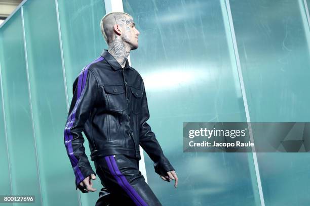 Lil Peep walks the runway during the Vlone Menswear Spring/Summer 2018 show as part of Paris Fashion Week on June 23, 2017 in Paris, France.