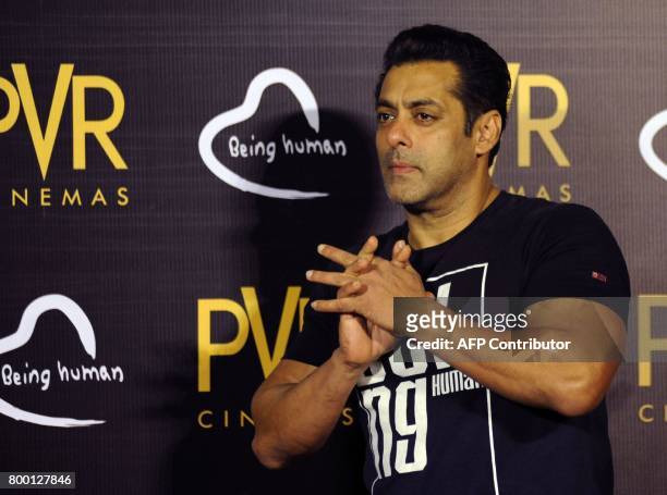 Indian Bollywood actor Salman Khan gestures during the announcement of his association with PVR Cinema and Being Human Foundation to support their...