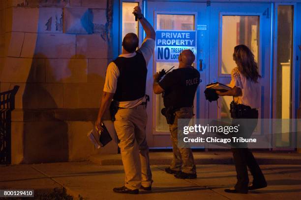 Chicago Police officers work at the scene where a 14-year-old and 15-year old boy were shot in the 2600 block of West Hirsch Street Thursday, June 22...