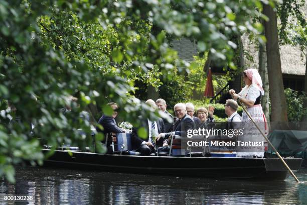 German President Frank-Walter Steinmeier and First Lady Elke Buedenbender ride with Minister President of Brandenburg. Dietmar Woidke on a flat-bed...