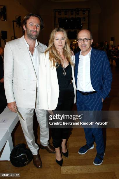 Artistic Director at Sonia Rykiel Julie de Libran standing between her husband Stephane de Luze and CEO of Sonia Rykiel, Jean-Marc Loubier attend the...