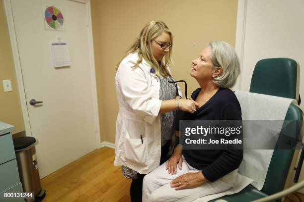 Marian Smith visits registered nurse practitioner Rachel Eisenberg for a checkup at a Planned Parenthood health center on June 23, 2017 in West Palm...