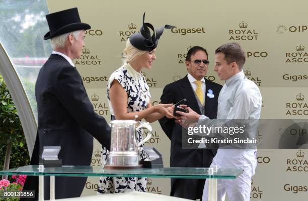 Phillip Schofield and Holly Willoughby present the King Edward VII Stakes to winner Abdulla Al Monsoon and jockey William Buick on day 4 of Royal...