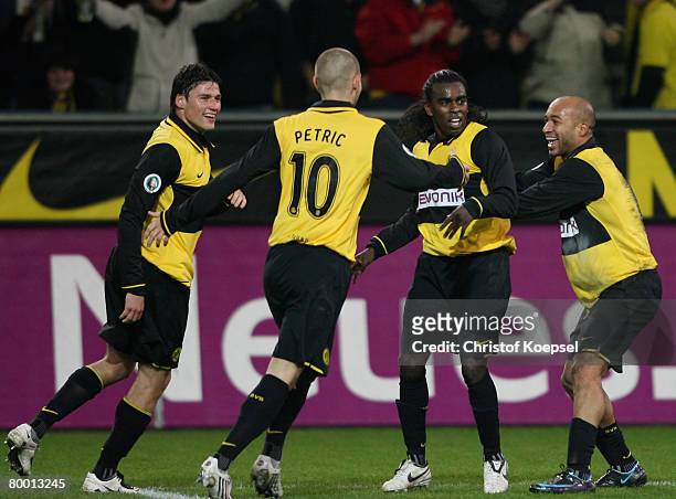 Tinga of Dortmund celebrates the second goal with Giovanni Frederrico , Mladen Petric and Dede during the DFB Cup quarter final match between...