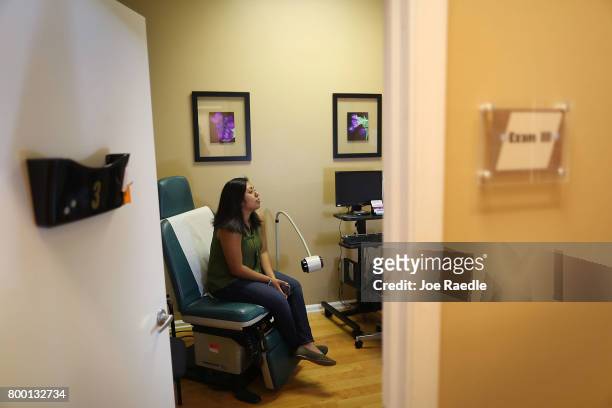 Natalia Reyes sits in the exam room as she gets a health care checkup at a Planned Parenthood health center on June 23, 2017 in West Palm Beach,...