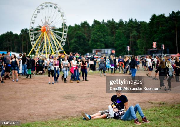 Couple takes a rest during the Hurricane Festival 2017 on June 23, 2017 in Scheessel, Germany. The gates of the festival have officially opened this...