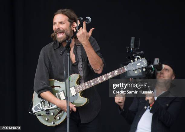 Lars Ulrich films Bradley Cooper as he performs on the Pyramid Stage for a film on day 2 of the Glastonbury Festival 2017 at Worthy Farm, Pilton on...