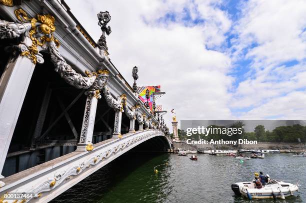 Cyrille Oumedjkane dives from The Pont Alexander III during the Olympic Day, Paris Olympic Park comes to life for Olympic Day on June 23, 2017 in...