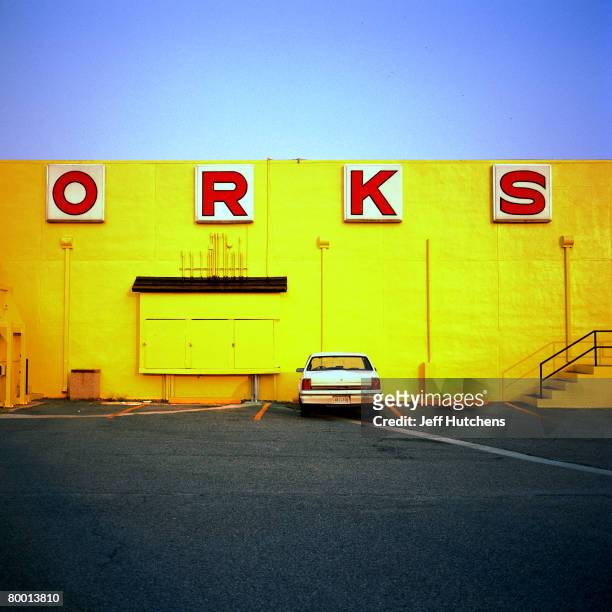 The O-R-K-S of fireworks identifies the content of one of the gift shops at South of the Border as a white car sits below the letters in a parking...