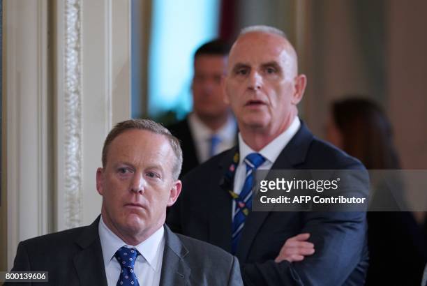White House Press Secretary Sean Spicer and Director of Oval Office operations Keith Schiller attend the signing ceremony for the Department of...