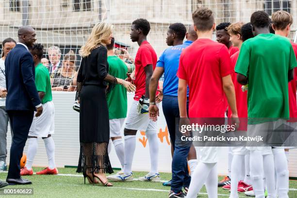 King Willem-Alexander of The Netherlands and Queen Maxima of The Netherlands attend a soccer clinic with dutch former players Clarence Seedor, Aaron...