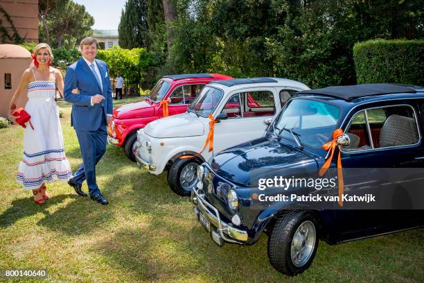 King Willem-Alexander of The Netherlands and Queen Maxima pose in the front of Fiat 500 in the colours of the Dutch flag at the residence of the...
