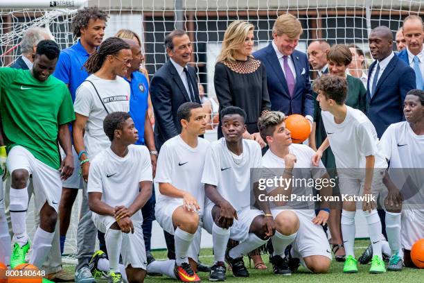 King Willem-Alexander of The Netherlands and Queen Maxima of The Netherlands attend a soccer clinic with dutch former players Clarence Seedor, Aaron...