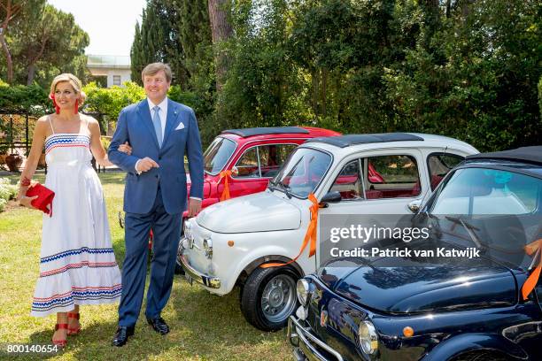 King Willem-Alexander of The Netherlands and Queen Maxima pose in the front of Fiat 500 in the colours of the Dutch flag at the residence of the...