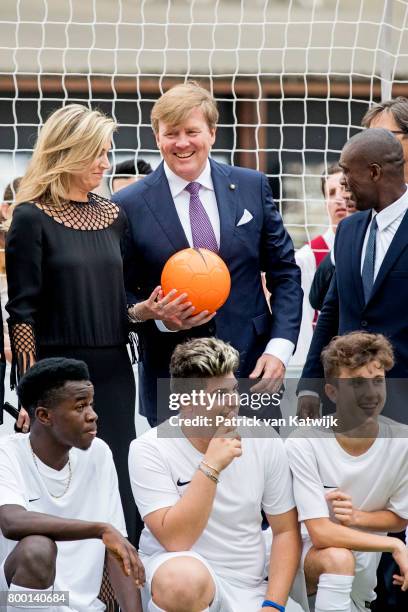 King Willem-Alexander of The Netherlands and Queen Maxima of The Netherlands attend a soccer clinic with dutch former players Clarence Seedor, Aaron...