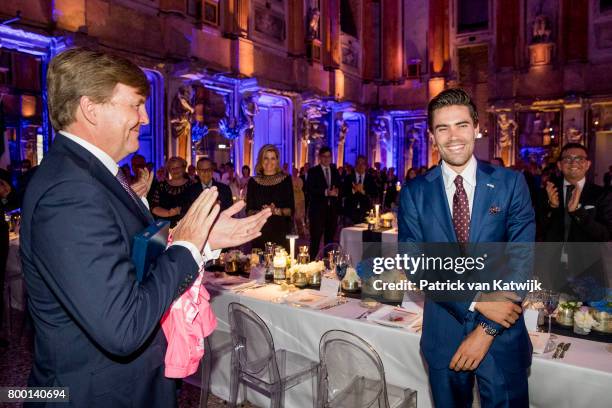 King Willem-Alexander of The Netherlands congratulates Dutch Tom Dumoulin winner of the Giro D'Italia during the third day of a royal state visit to...