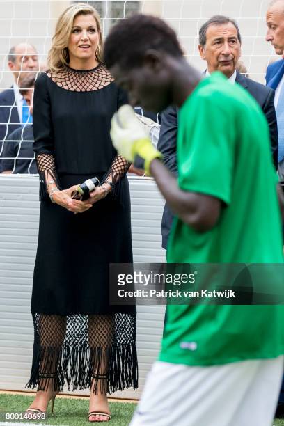 Queen Maxima of The Netherlands attends a soccer clinic with dutch former players Clarence Seedor, Aaron Winter, Pierre van Hooijdonk and Edgar...