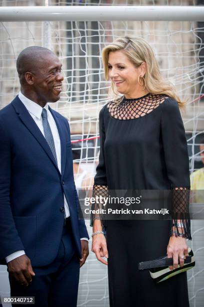 Clarence Seedorf and Queen Maxima of The Netherlands attend a soccer clinic with dutch former players Clarence Seedor, Aaron Winter, Pierre van...