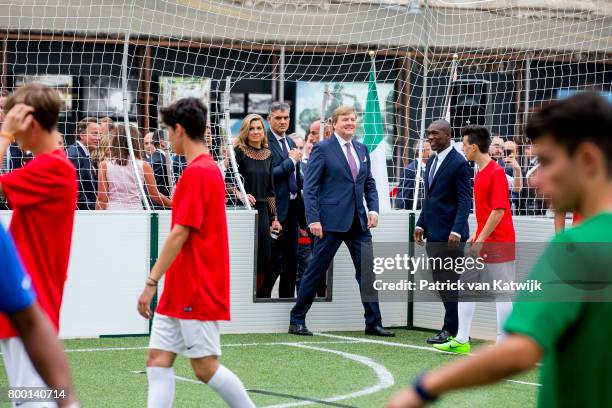 King Willem-Alexander of The Netherlands and Queen Maxima of The Netherlands attend a soccer clinic with dutch former players Clarence Seedor, Aaron...