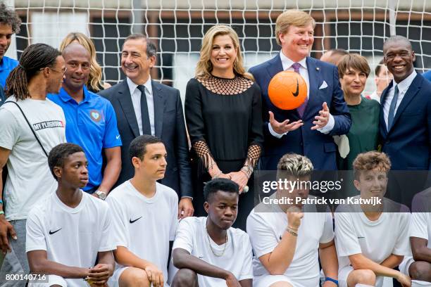 King Willem-Alexander of The Netherlands and Queen Maxima of The Netherlands attend a soccer clinic with dutch former players Clarence Seedor, Aaron...