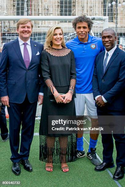 King Willem-Alexander of The Netherlands and Queen Maxima of The Netherlands attend a soccer clinic with dutch former players Clarence Seedor, Aaron...