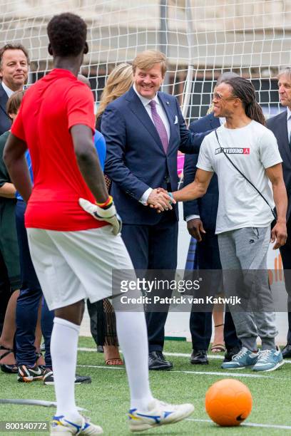 King Willem-Alexander of The Netherlands and Edgar Davids attend a soccer clinic with dutch former players Clarence Seedor, Aaron Winter, Pierre van...