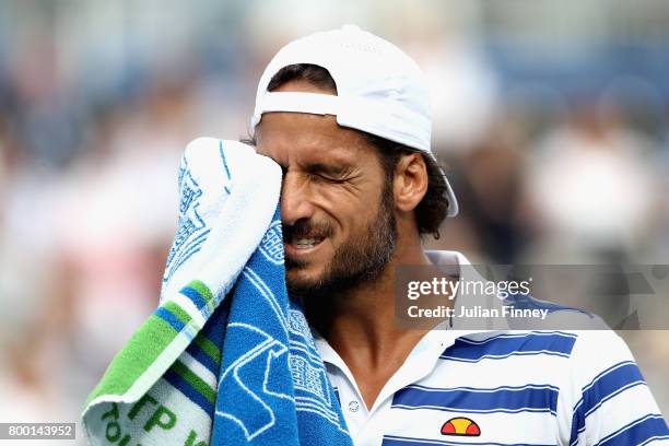 Feliciano Lopez of Spain looks dejected during the mens singles quarter final match against Tomas Berdych of The Czech Republic on day five of the...