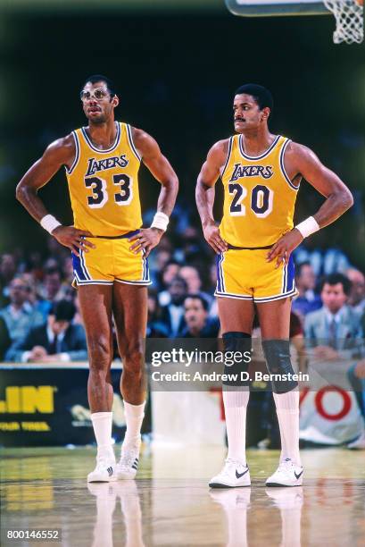 Maurice Lucas and Kareem Abdul-Jabbar of the Los Angeles Lakers during a game played circa 1989 at the Great Western Forum in Inglewood, California....